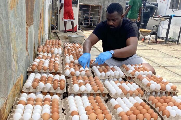 John Dumelo checking his eggs after a successful season