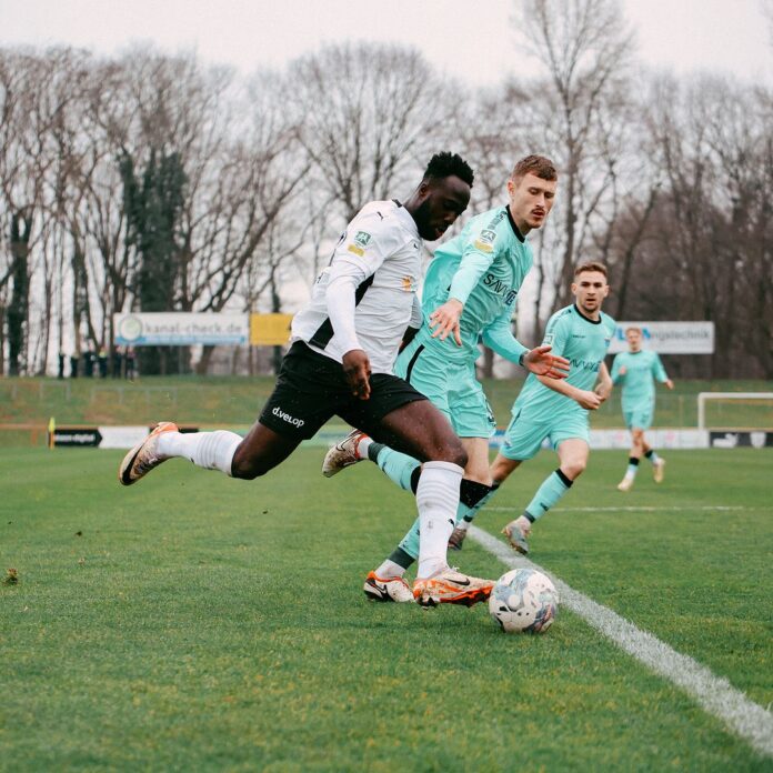 Ghanaian midfielder Raphael Assibey-Mensah scores for FC Bocholt against Velbert